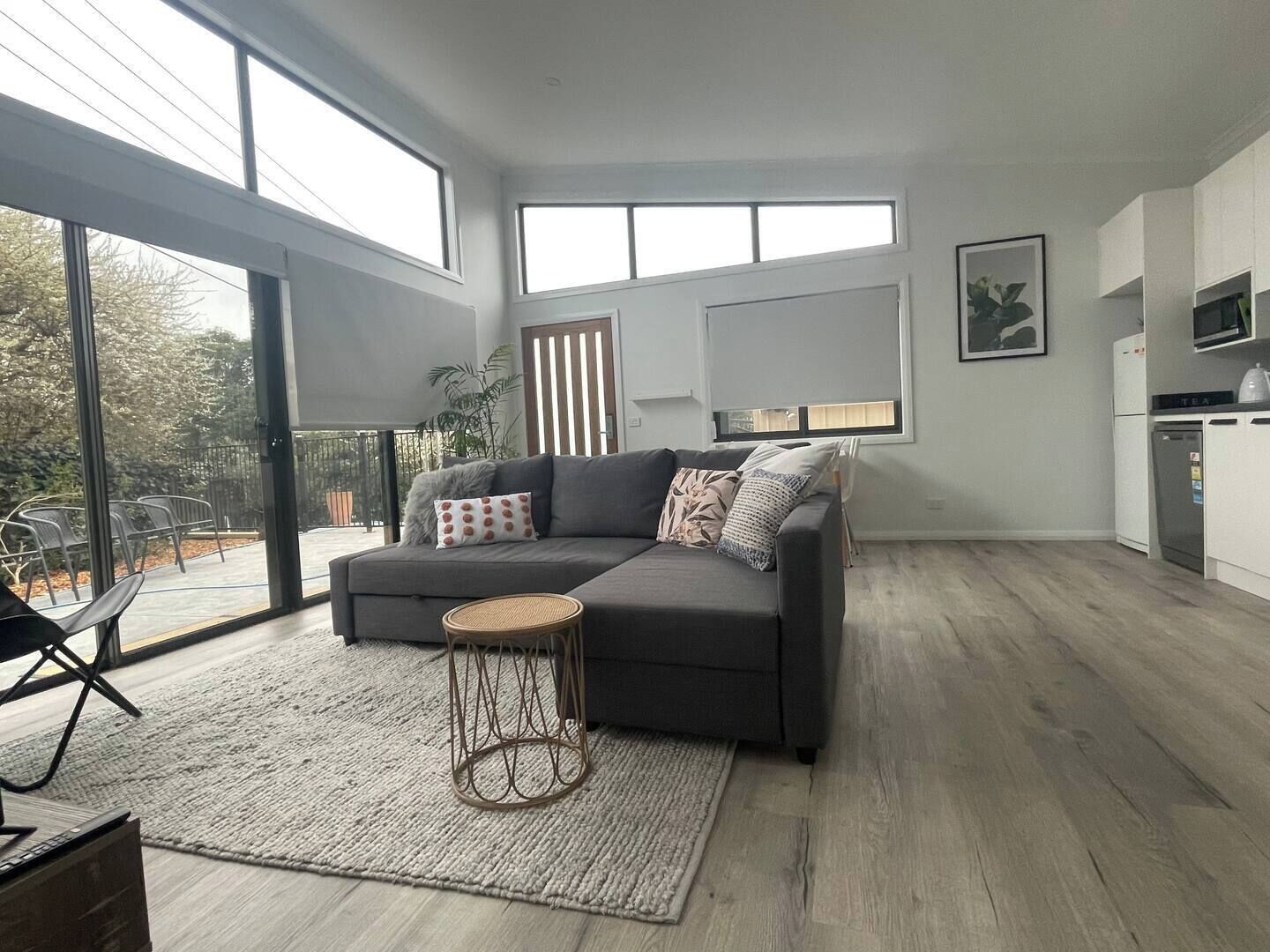 Large - open plan living/dining area - heaps of sunlight (block out blinds) and high ceilings.

Big comfy lounge with a single occasional chair :)
