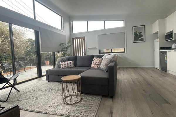 Large - open plan living/dining area - heaps of sunlight (block out blinds) and high ceilings.
Big comfy lounge with a single occasional chair :)