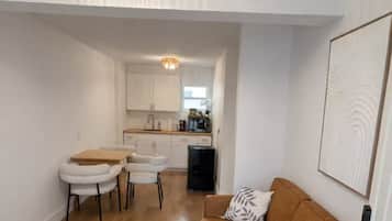 Apartment, 2 Bedrooms, Patio | Living area | 50-inch Smart TV with digital channels, streaming services