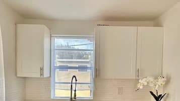 Apartment, 2 Bedrooms | Private kitchen | Mini-fridge, microwave, stovetop, coffee/tea maker