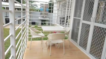 Exclusive Villa, Balcony, Garden View | Outdoor dining