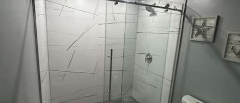 Shower, hair dryer, towels, soap