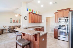 Fridge, microwave, oven, stovetop - Spacious 4-bedroom Retreat Minutes From the Beach and The Wharf (Foley)