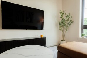Apartment, Non Smoking | Living area | 42-inch flat-screen TV with cable channels - Above The Roots - Stylish Square (Washington)