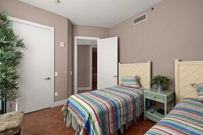 Cozy and comfortable guest bedroom features two twin beds and views of the bay. - Sapphire #704 | Beachfront Condo • Gulf & Bay Views • Resort Pool (South Padre Island)
