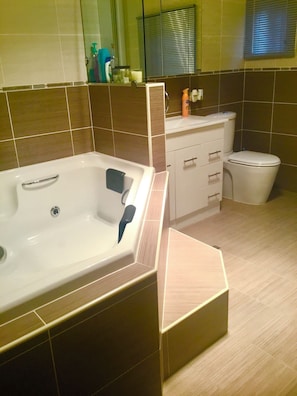 Shower, jetted bath, towels, soap
