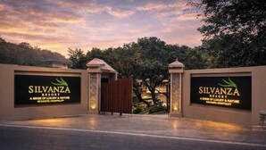 The entrance to Silvanza Resort with a signboard displaying the name and tagline. - Silvanza Resort By Nivanta (Ramnagar)