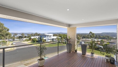 Beautiful modern, upstairs apartment with stunning water and mountain views.