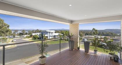Beautiful modern, upstairs apartment with stunning water and mountain views.