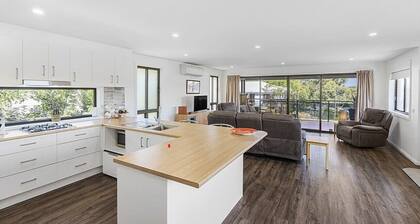 Beautiful modern, upstairs apartment with stunning water and mountain views.