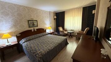 Deluxe Suite, City View | In-room safe, desk, laptop workspace, free WiFi