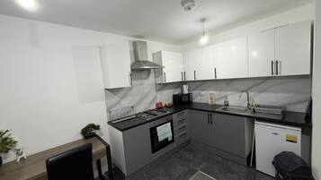 Fridge, microwave, oven, cookware/dishes/utensils