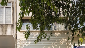 The exterior of Sora Hotel Hanoi, featuring a modern facade, large windows, and a welcoming entrance with potted plants. - Sora Hotel Hanoi (Hanoi)