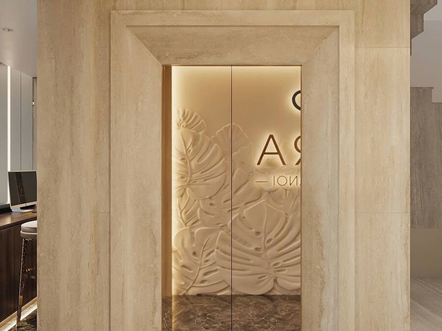 A modern interior with a marble floor, a wall with a leaf pattern, and a door with the text "A - 102".