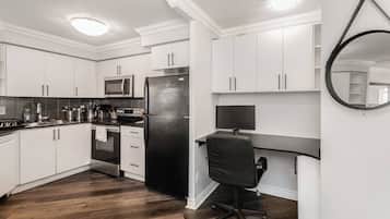 Fridge, dishwasher, coffee/tea maker, cookware/dishes/utensils