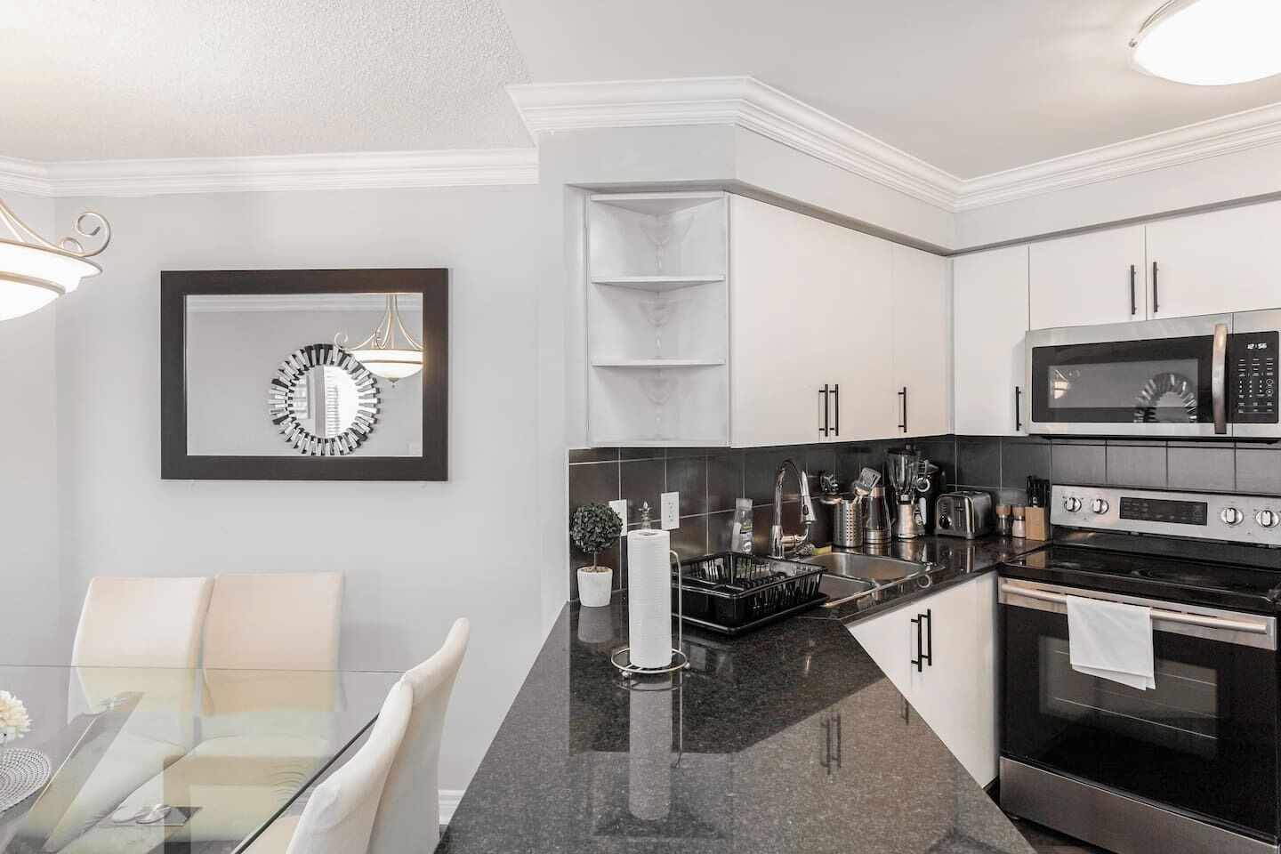 Fridge, dishwasher, coffee/tea maker, cookware/dishes/utensils