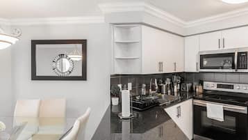 Fridge, dishwasher, coffee/tea maker, cookware/dishes/utensils