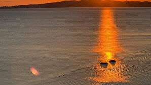 A calm body of water reflecting the sun. - Suite Torre Azzurra B&B Rooftop Sea View (Follonica)
