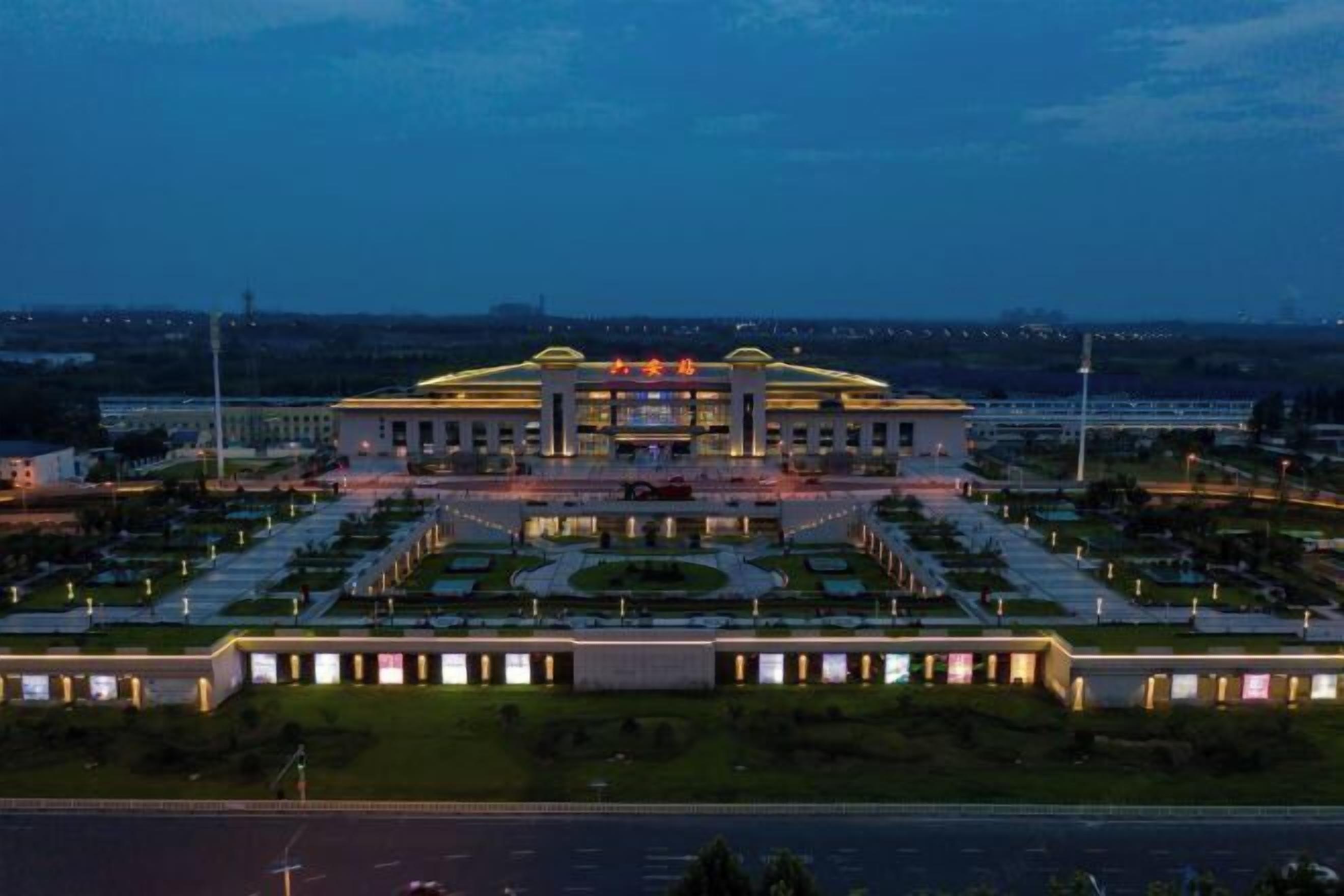 A large, well-lit building with a symmetrical facade and a central entrance.