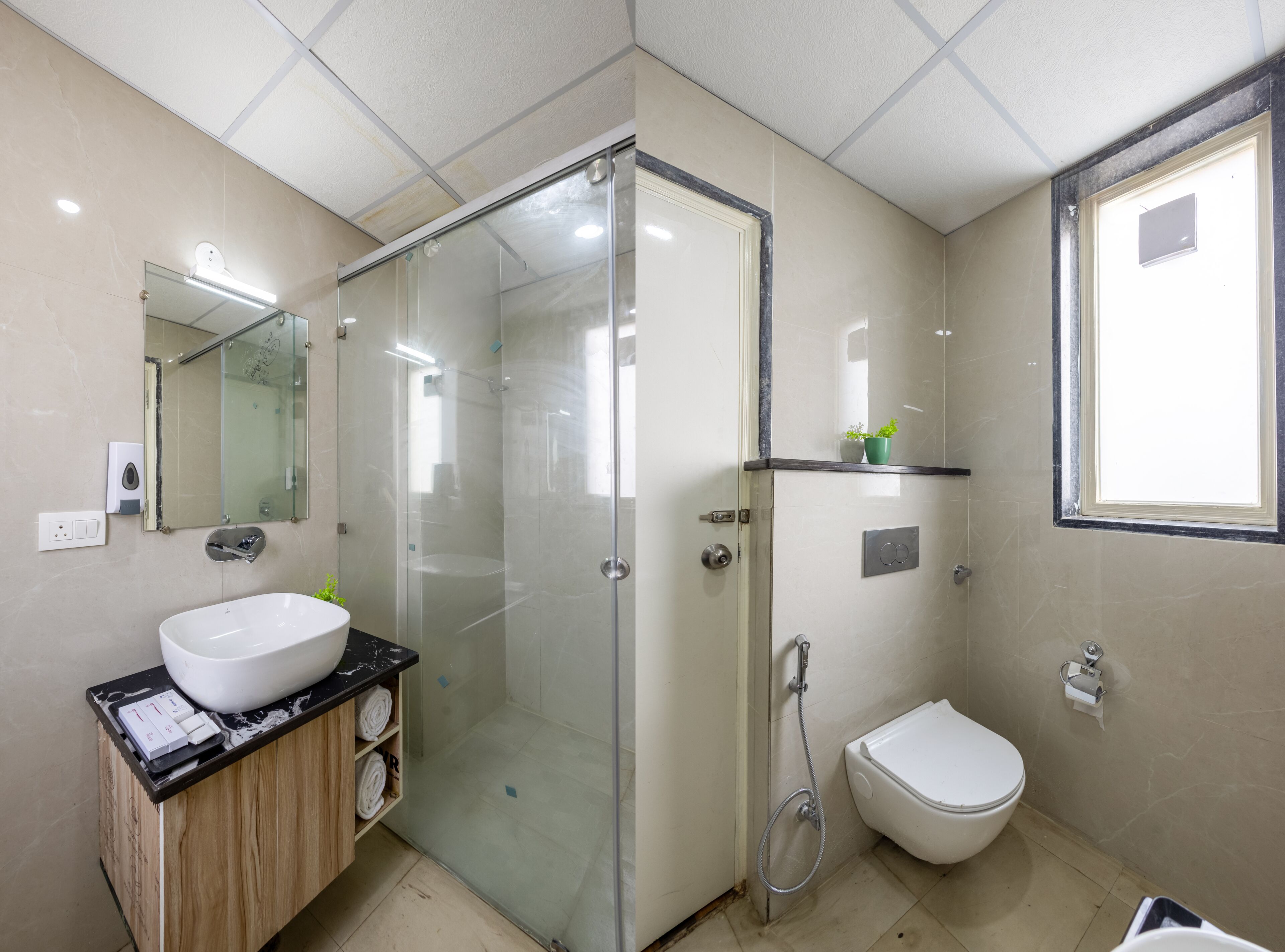 Une salle de bain moderne avec une douche à parois de verre, un lavabo blanc et des toilettes.