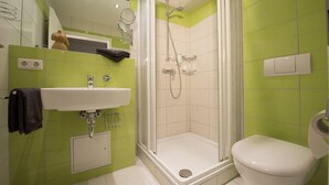 A bathroom with a shower, sink, and toilet. - Condé RE-10, Germany (Stolpe auf Usedom)