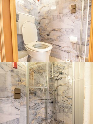 Apartament bàsic | Bany | Dutxa, articles de tocador gratuïts, assecador de cabells i tovalloles 