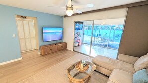 Smart TV - Retro coastal Fort Myers retreat with private yard, spa & fire pit. Two bedrooms, two baths, sun room with fitness wall, screened patio, and easy access to RSW, FGCU, shopping, and beaches. (Fort Myers)