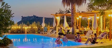 Outdoor pool, open 7:00 AM to 10:30 PM, pool umbrellas, pool loungers