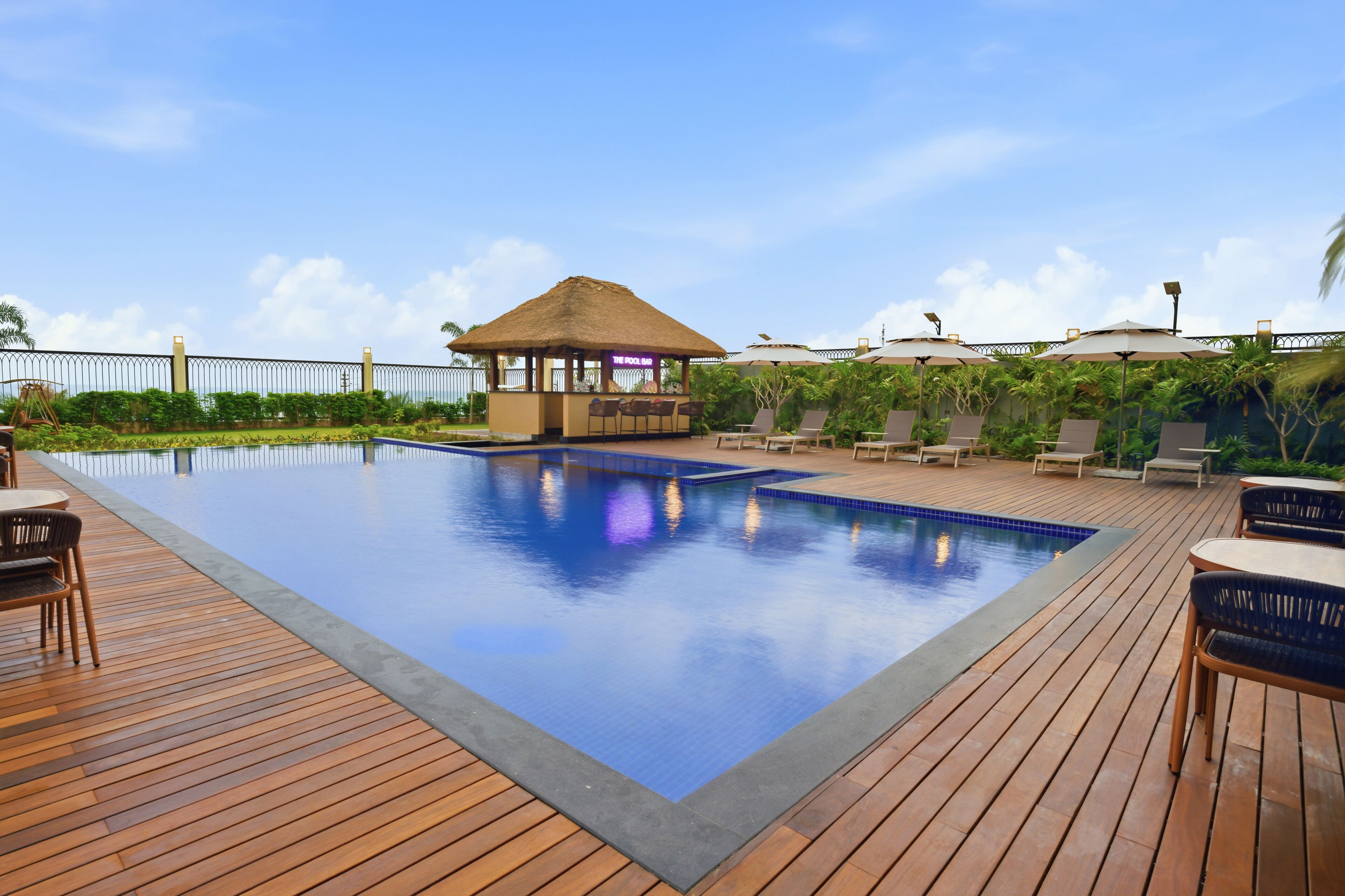 Outdoor pool, open 7:00 AM to 8:00 PM, pool umbrellas, pool loungers
