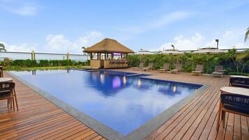 Outdoor pool, open 7:00 AM to 8:00 PM, pool umbrellas, pool loungers