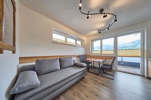 Comfort Apartment, 2 Bedrooms, Mountain View | Living area | 50-inch flat-screen TV with cable channels - Apartment Alpenstyle Ennstal (Aich)