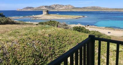 Elegant 19 sq m room featuring a double bed or two single beds and a private bathroom with shower, bidet, and hairdryer. The room also features an outdoor space with a sea view, a patio or terrace, furnished with a table and chairs. Breakfast is included