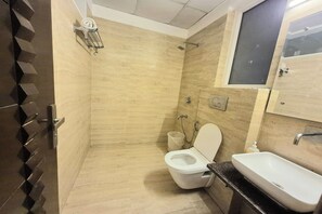 Deluxe Room | Bathroom | Shower, rainfall showerhead, free toiletries, towels - Premium Nest (Gurugram)