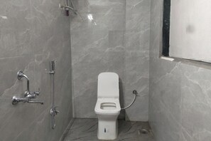Deluxe Room | Bathroom | Shower, rainfall showerhead, free toiletries, slippers - Sairam Executive (Pune)