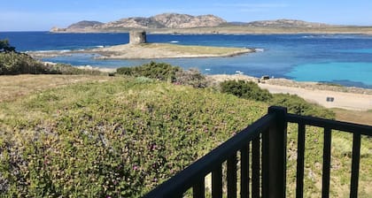 Functional 28 sq m room.Comprising a double bed, two single beds, and a private bathroom with shower, bidet, and hairdryer. The room also features an outdoor space with a sea view, a patio or terrace, and a table and chairs. Breakfast is included in the