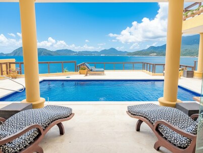 Clifftop Luxury: 180° Ocean Views, Private Pool, Beach Access, Sleeps 12