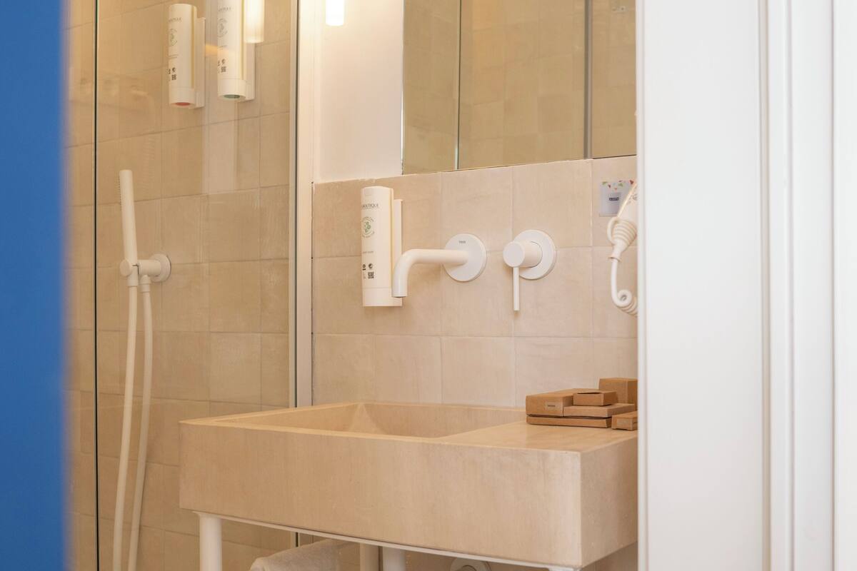 Shower, hair dryer, towels, soap