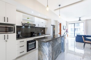 Deluxe Apartment, Pool View | Private kitchen | Coffee/tea maker, blender, dining tables - Quiet 1BR Apartment Walk to Bávaro Beach (Punta Cana)