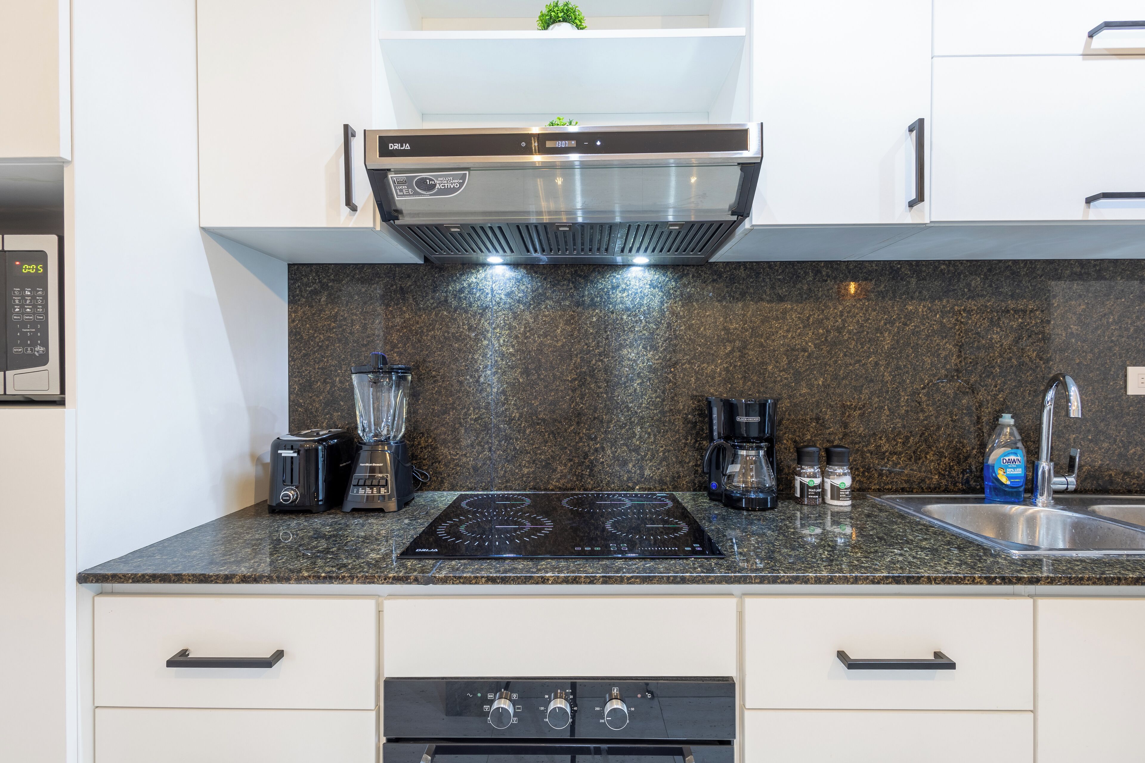 Deluxe Apartment, Pool View | Private kitchen | Coffee/tea maker, blender, dining tables