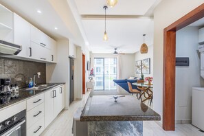 Deluxe Apartment, Pool View | Private kitchen | Coffee/tea maker, blender, dining tables - Quiet 1BR Apartment Walk to Bávaro Beach (Punta Cana)