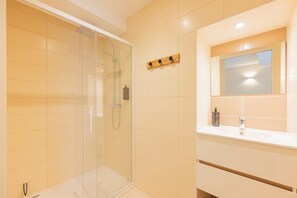 Shower, hair dryer, towels, soap