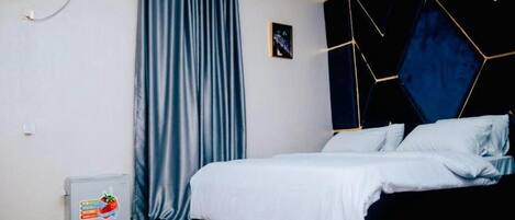 Deluxe Room, Balcony, City View | Desk, laptop workspace, blackout drapes, soundproofing