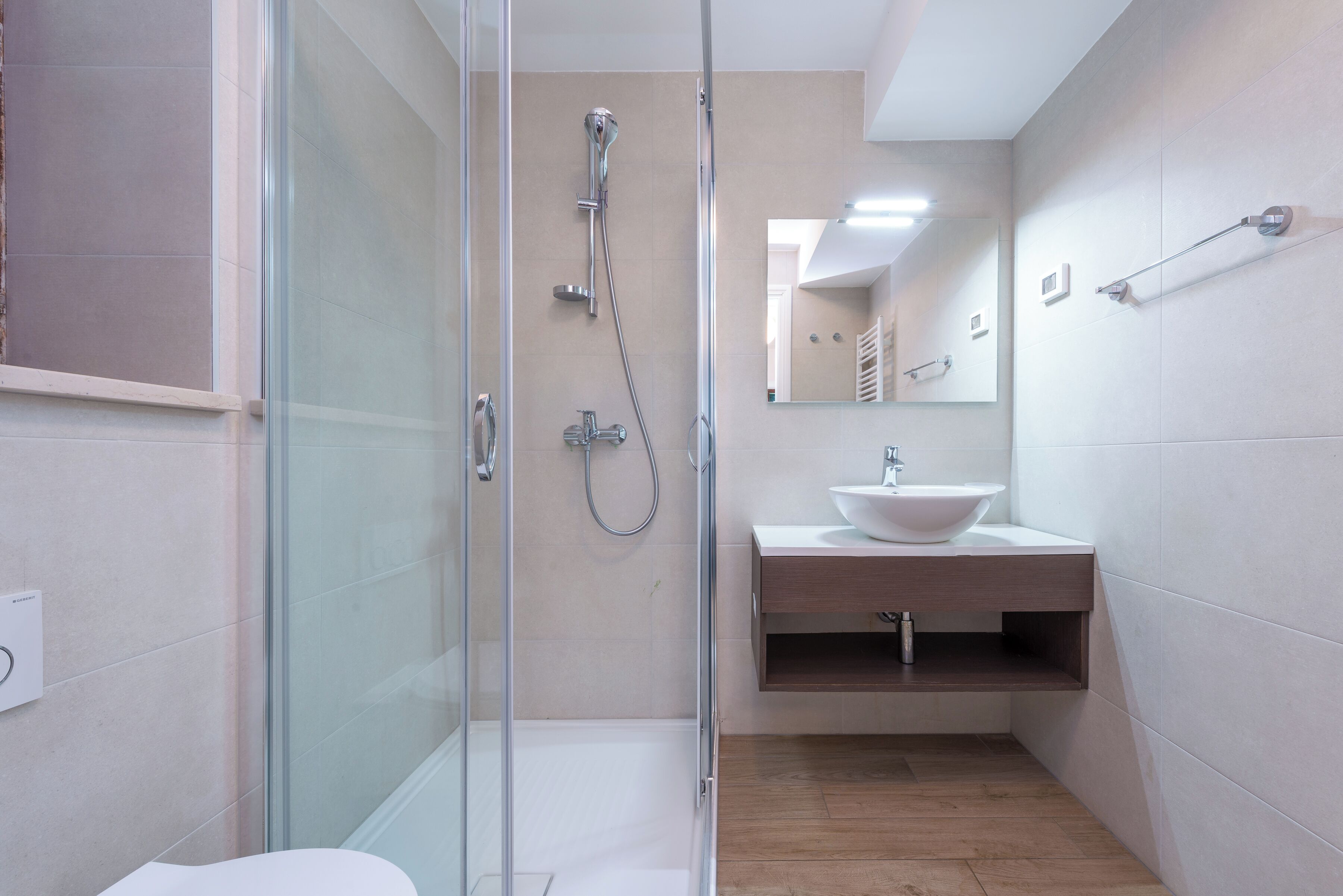 Shower, hair dryer, towels, toilet paper
