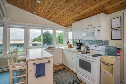 Enjoy the large deck with wooded ocean views.