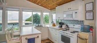 Enjoy the large deck with wooded ocean views.