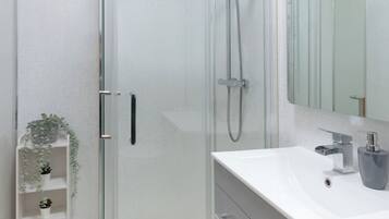 Shower, hair dryer, towels, soap