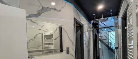 Shower, towels, soap, toilet paper