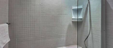 Shower, hair dryer, towels, shampoo