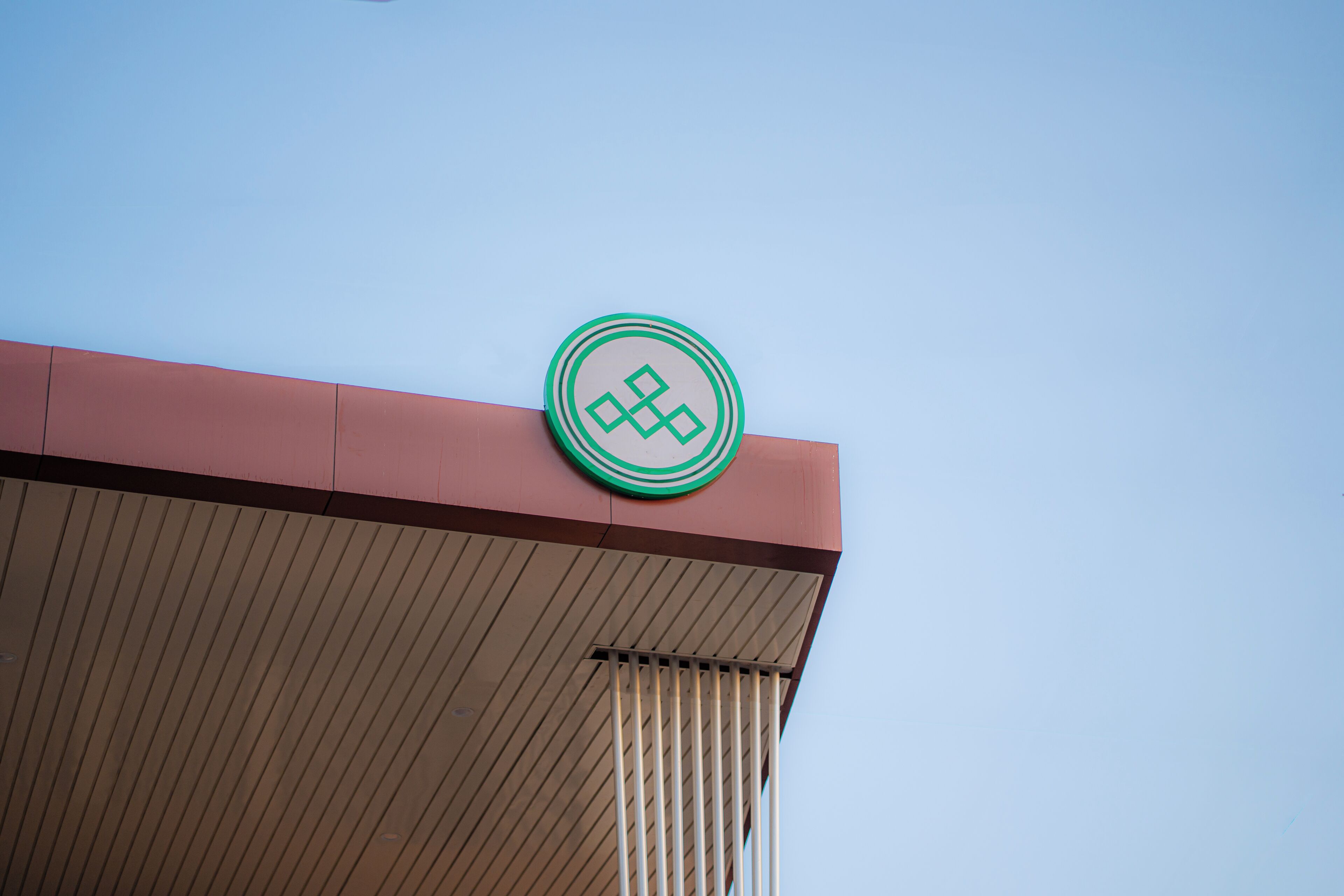 A building with a distinctive logo on the roof.