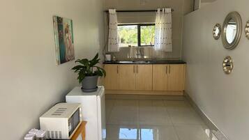 Fridge, microwave, cookware/dishes/utensils